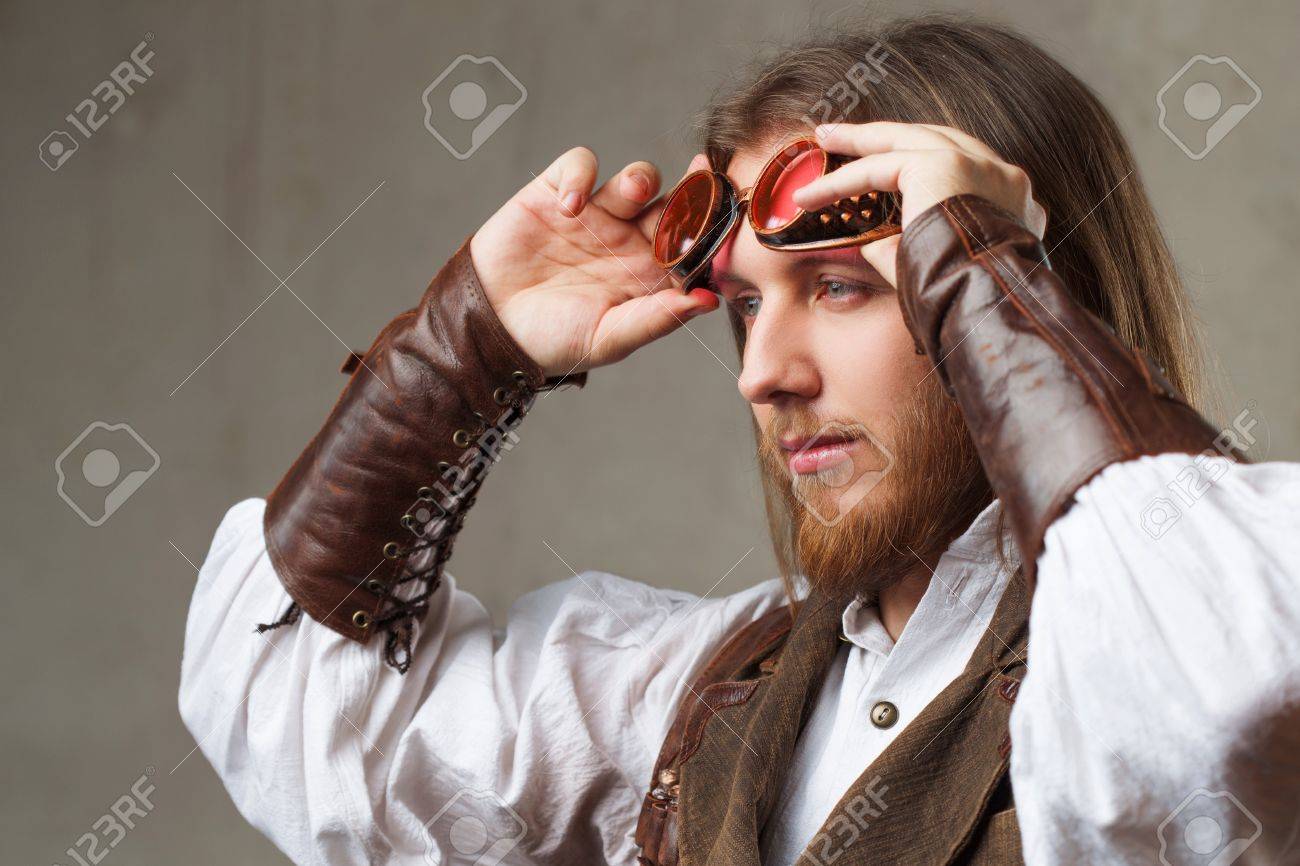 Handsome Male Steam Punk Retro Man Portrait Over Grunge Background