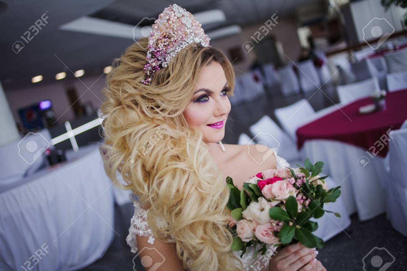 Young Fashion Bride With Perfect Skin And Make Up Curly Hair