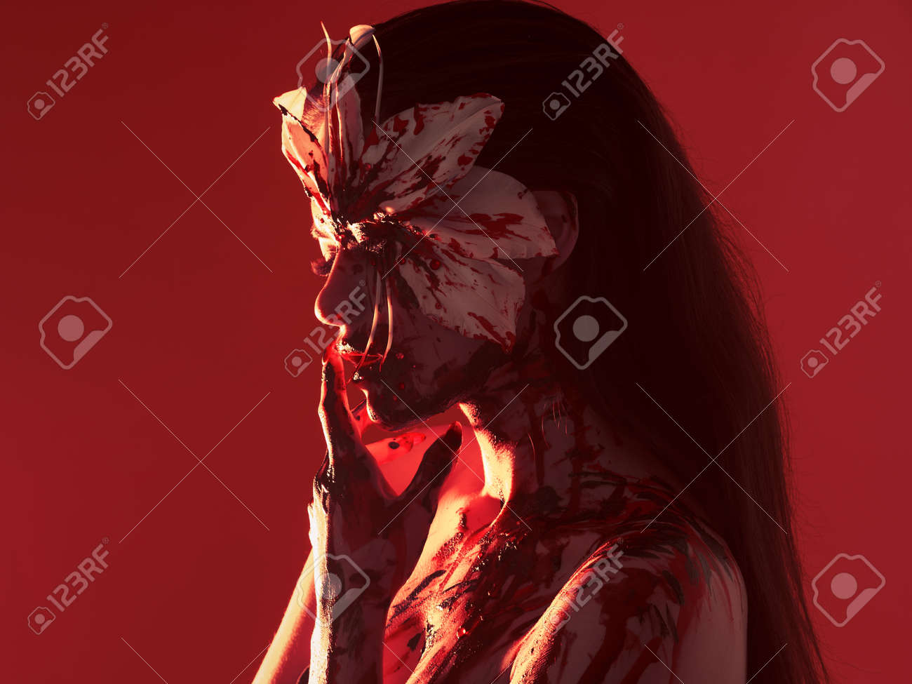 Blood Lily Scary And Halloween Image Beautiful Young Woman With A Bloody Flower Make Up And Makeup Stock Photo Picture And Royalty Free Image Image