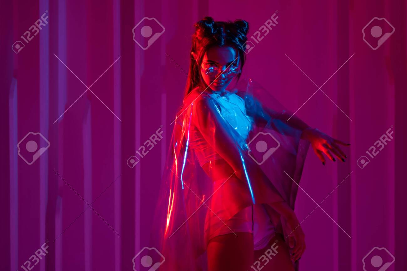 Premium Photo  Cyberpunk woman futuristic portrait urban fashion  mysterious girl in face bandana buff mask black leather jacket in red  purple neon light color steam white led glow at dark night