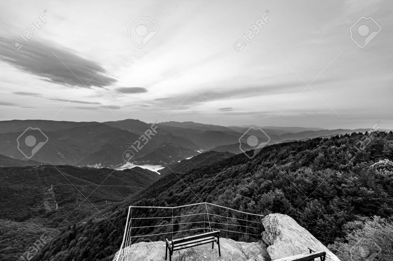 Calm scenery springtime black and white landscape high altitude observation deck view with picturesque rocks