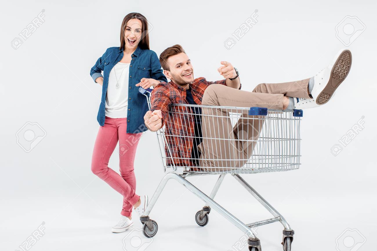 Woman Leaning On Shopping Cart With Happy Young Man Stock Photo, Picture  and Royalty Free Image. Image 72271290., image size:1300x867