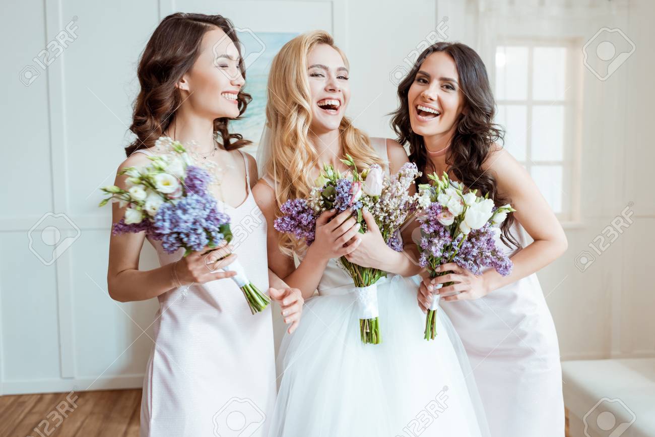 laughing bride with bridesmaids - 94853044 laughing bride with bridesmaids - 94853044