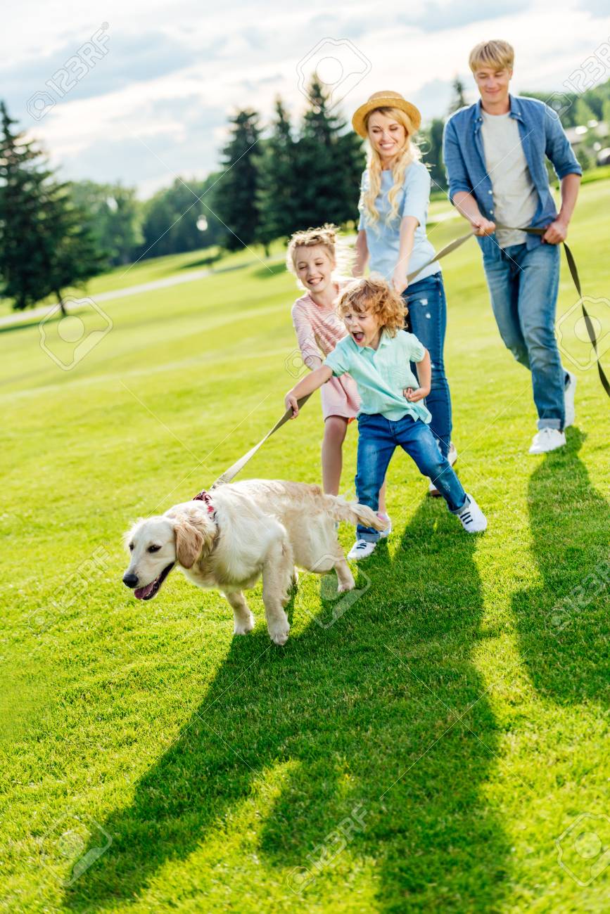 kids walking dog