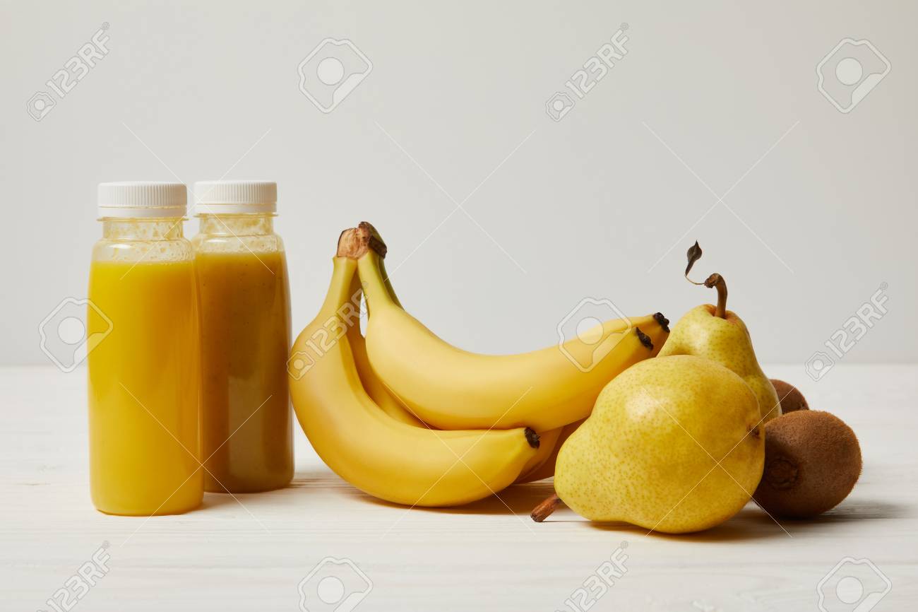 Download Bottles With Yellow Smoothies With Bananas Pears And Kiwis On Stock Photo Picture And Royalty Free Image Image 106605322 Yellowimages Mockups