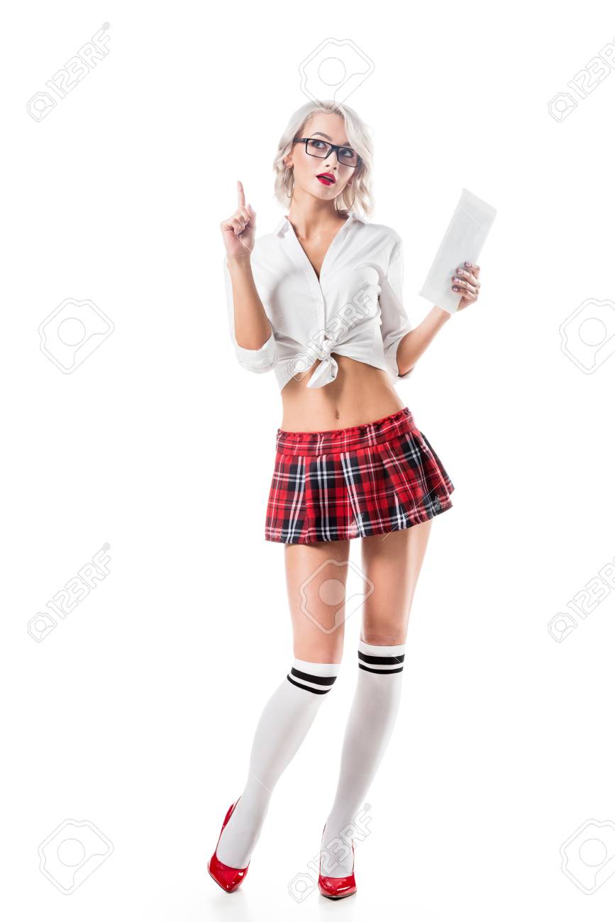 Seductive Schoolgirl In Short Plaid Skirt With Digital Tablet Pointing Up Isolated On White Stock Photo Seductive Schoolgirl In Short Plaid Skirt With Digital Tablet Pointing Up Isolated On White Stock Photo
