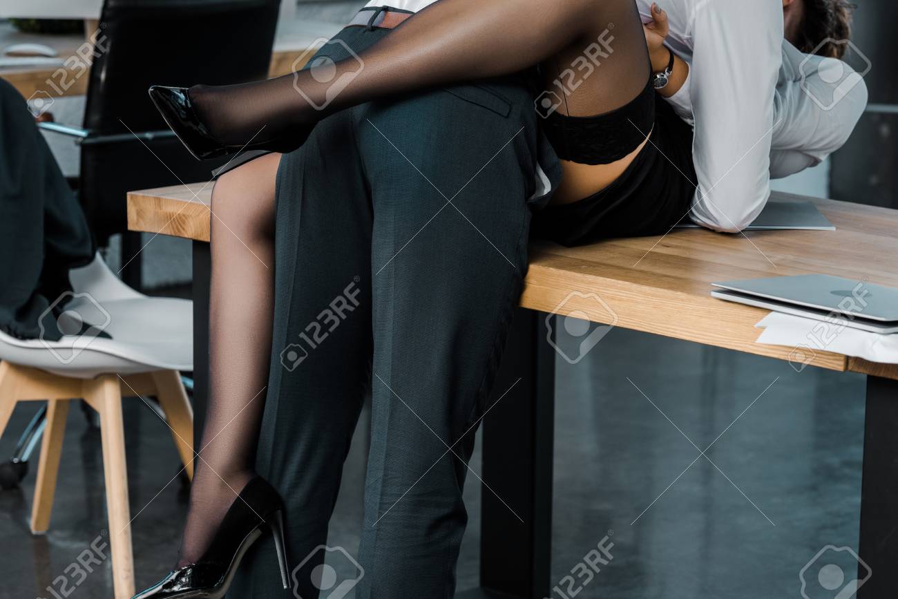 cropped shot of passionate businesswoman and businessman at workplace in office - 111171802 cropped shot of passionate businesswoman and businessman at workplace in office - 111171802