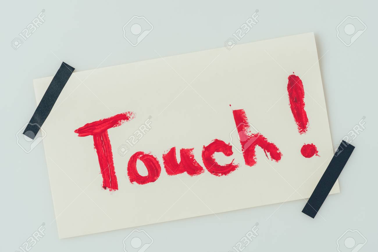 top view of note with word touch isolated on white word note