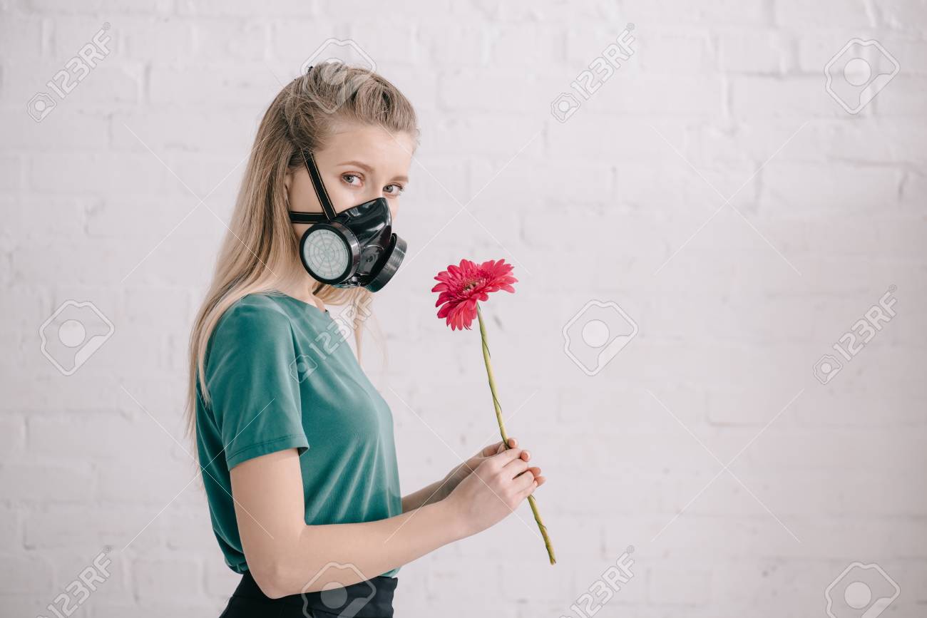 Blonde Girl With Pollen Allergy Wearing Respiratory Mask And Stock Photo Picture And Royalty Free Image Image 121416583