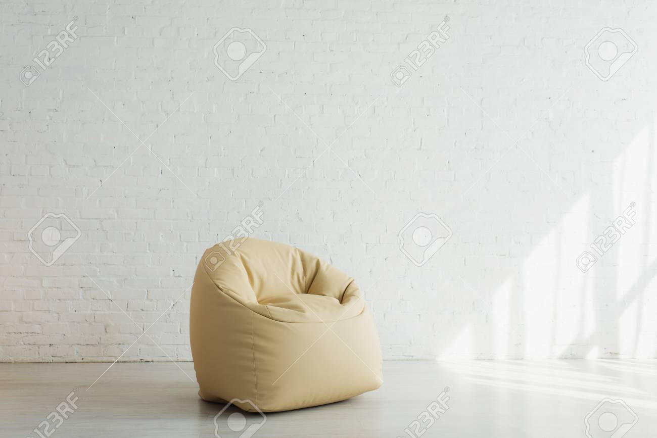 Download Sunlight Near Beige Bean Bag Chair Near Brick Wall In Modern Stock Photo Picture And Royalty Free Image Image 121433580 PSD Mockup Templates