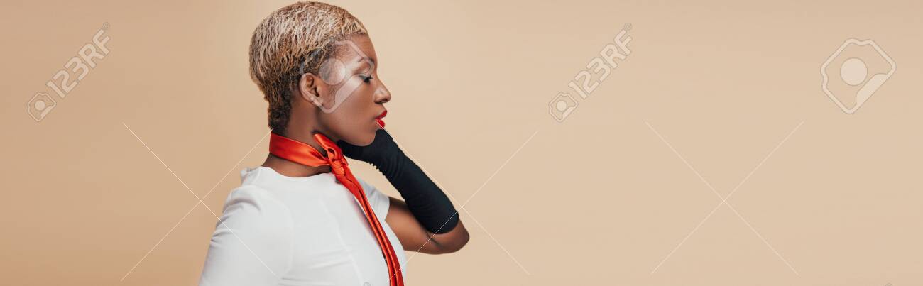 Elegant African American Woman With Short Hair Posing In White