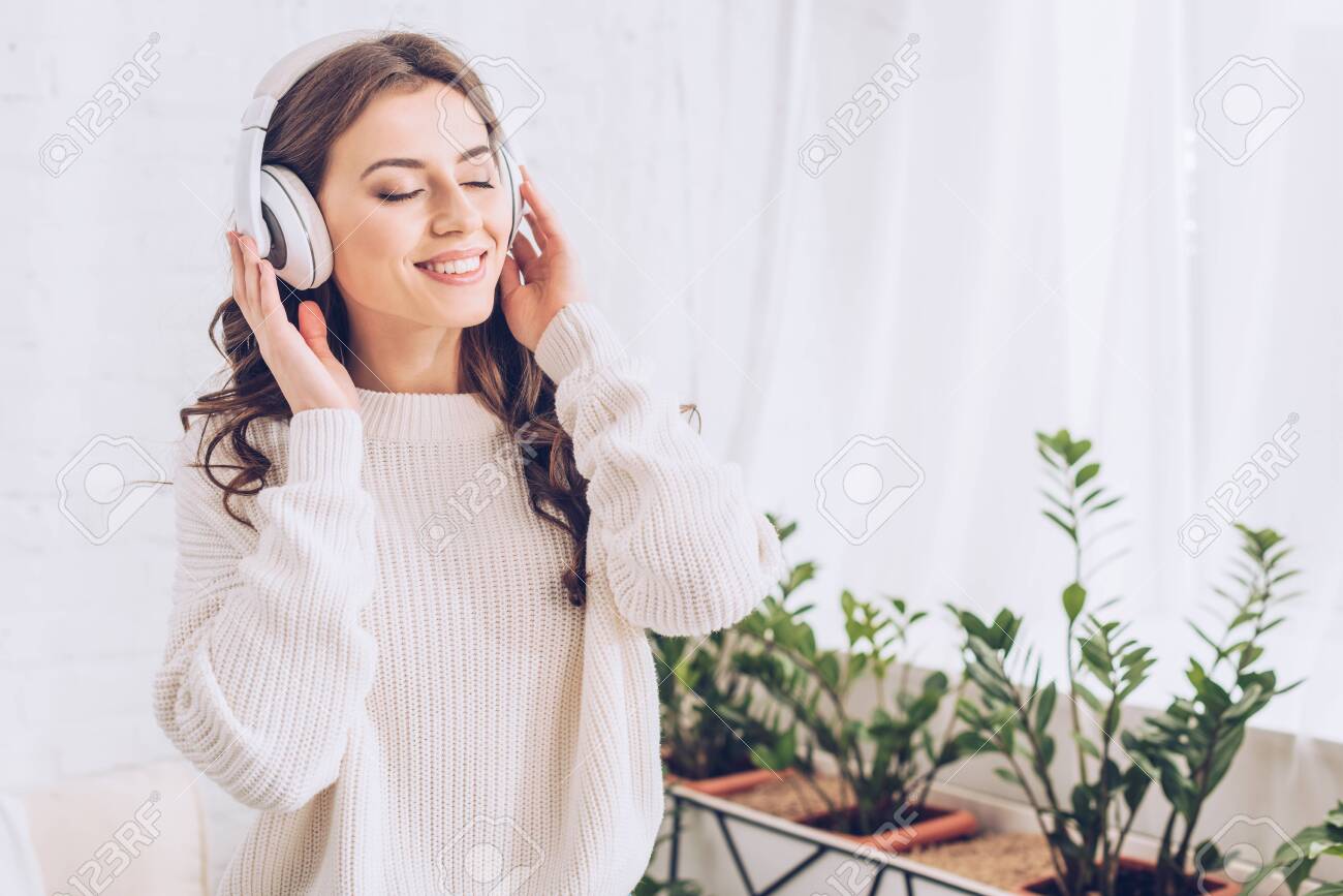 Happy Young Woman Listening Music In Headphones With Closed Eyes Stock  Photo, Picture and Royalty Free Image. Image 125331541., image size:1300x867