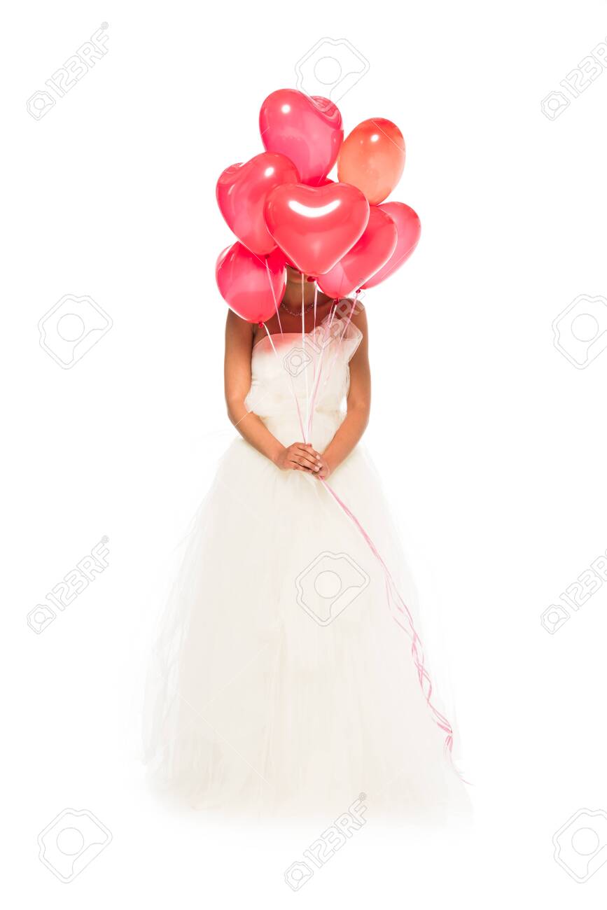 African American Bride Covering Face With Heart Shaped Balloons