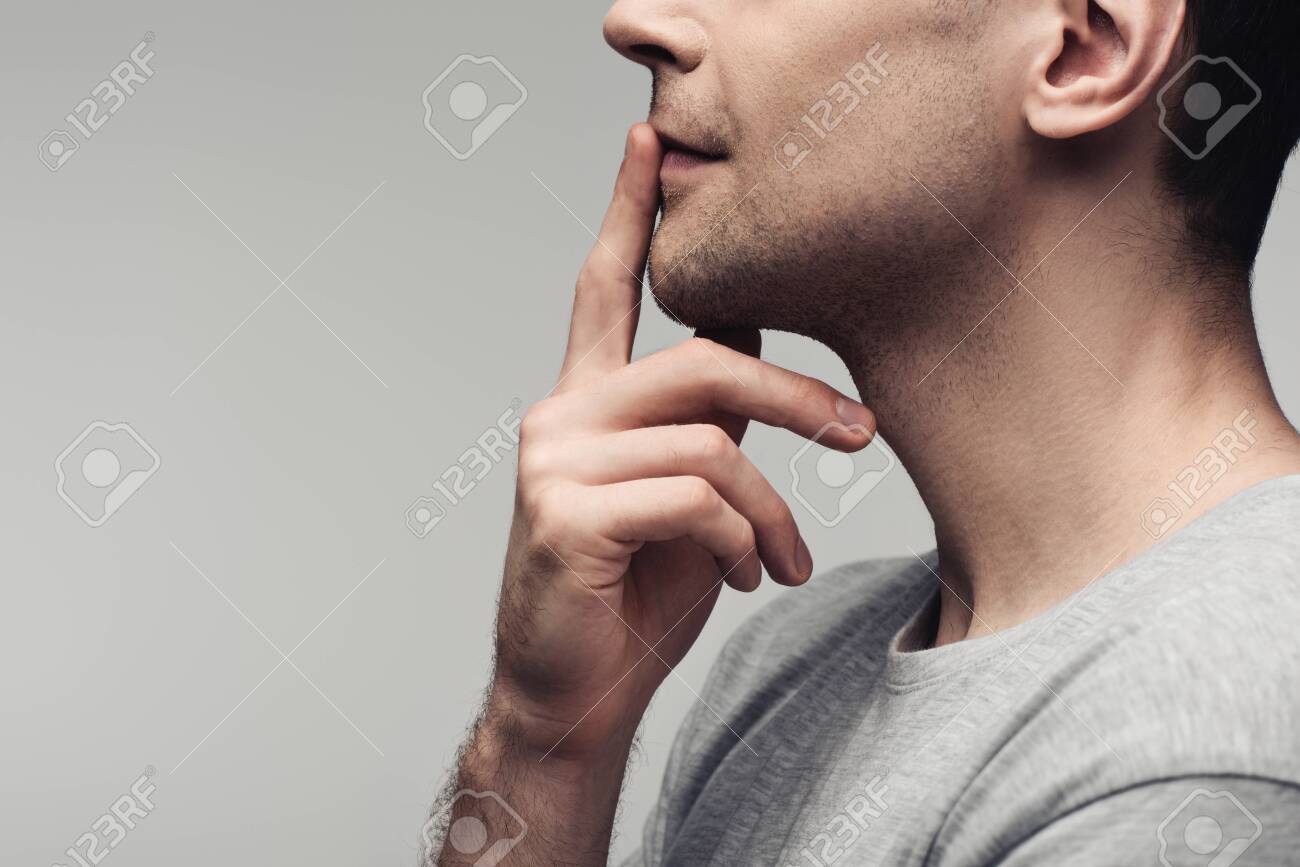 partial view of dumb man showing silence sign isolated on grey, human emotion and expression concept - 128147265 partial view of dumb man showing silence sign isolated on grey, human emotion and expression concept - 128147265