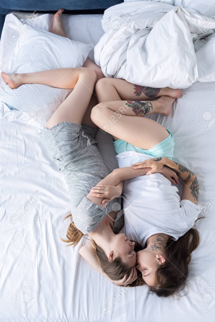 Lesbians Kissing On Bed