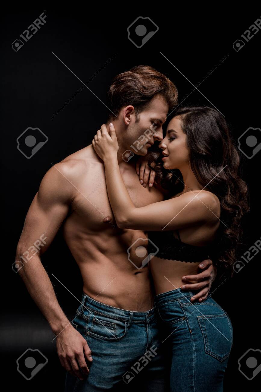 beautiful seductive couple hugging, isolated on black - 134010603 beautiful seductive couple hugging, isolated on black - 134010603