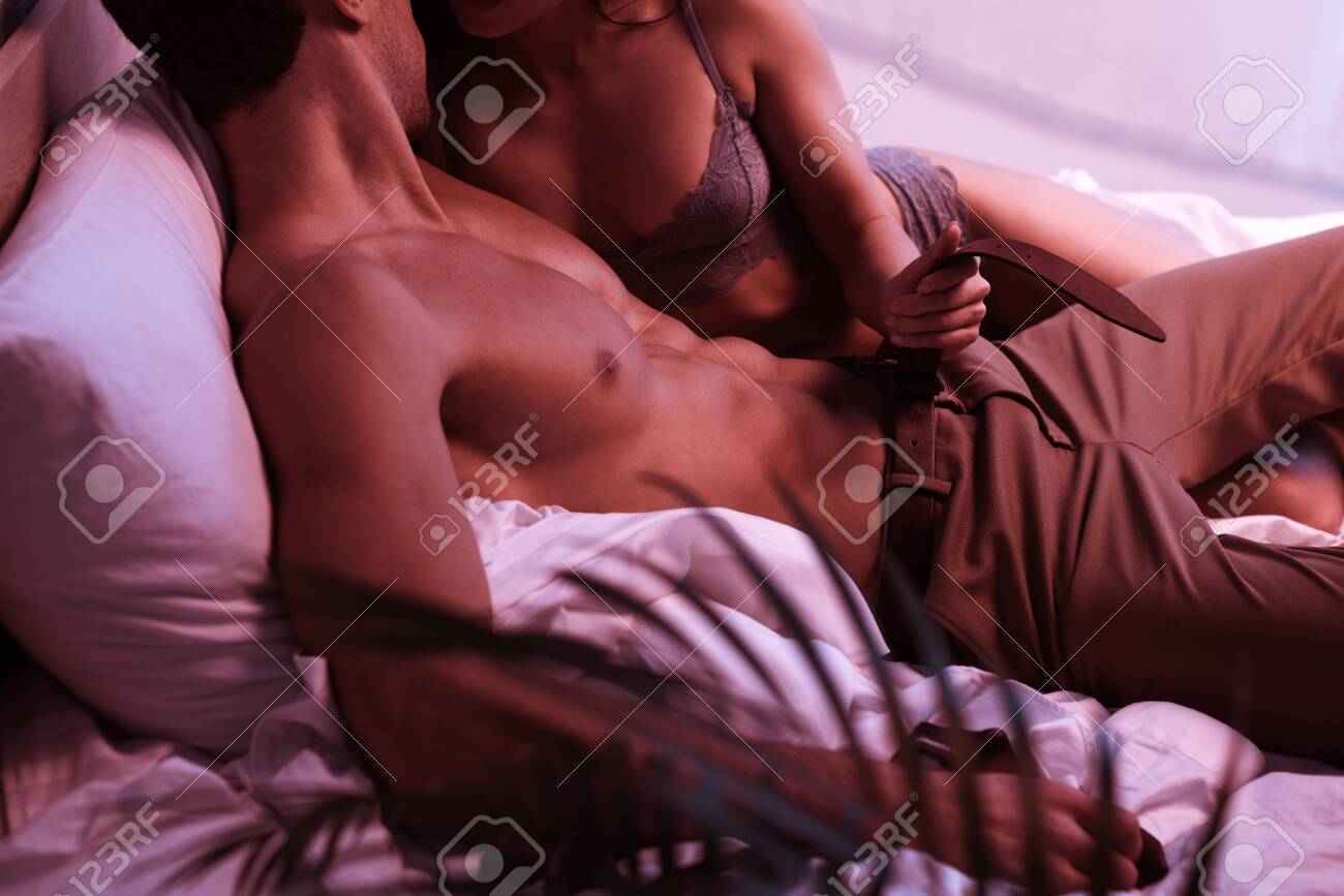 Cropped View Of Passionate Girl Undressing Sexy Boyfriend In Bed Stock  Photo, Picture and Royalty Free Image. Image 135690175.