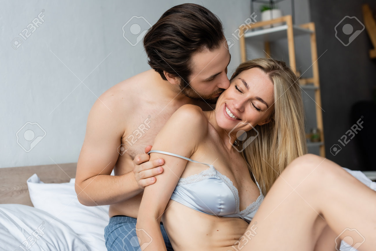Passionate embrace between young man and woman