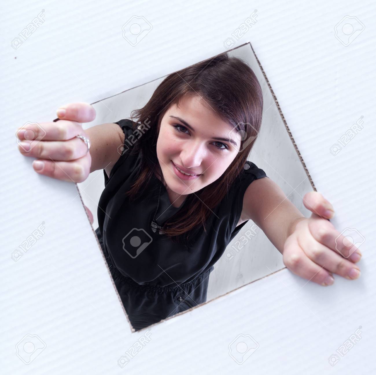 Teenager Crawling And Peeking Out Of A Rectangular Hole In Cardboard Layer  Stock Photo, Picture and Royalty Free Image. Image 12148310.