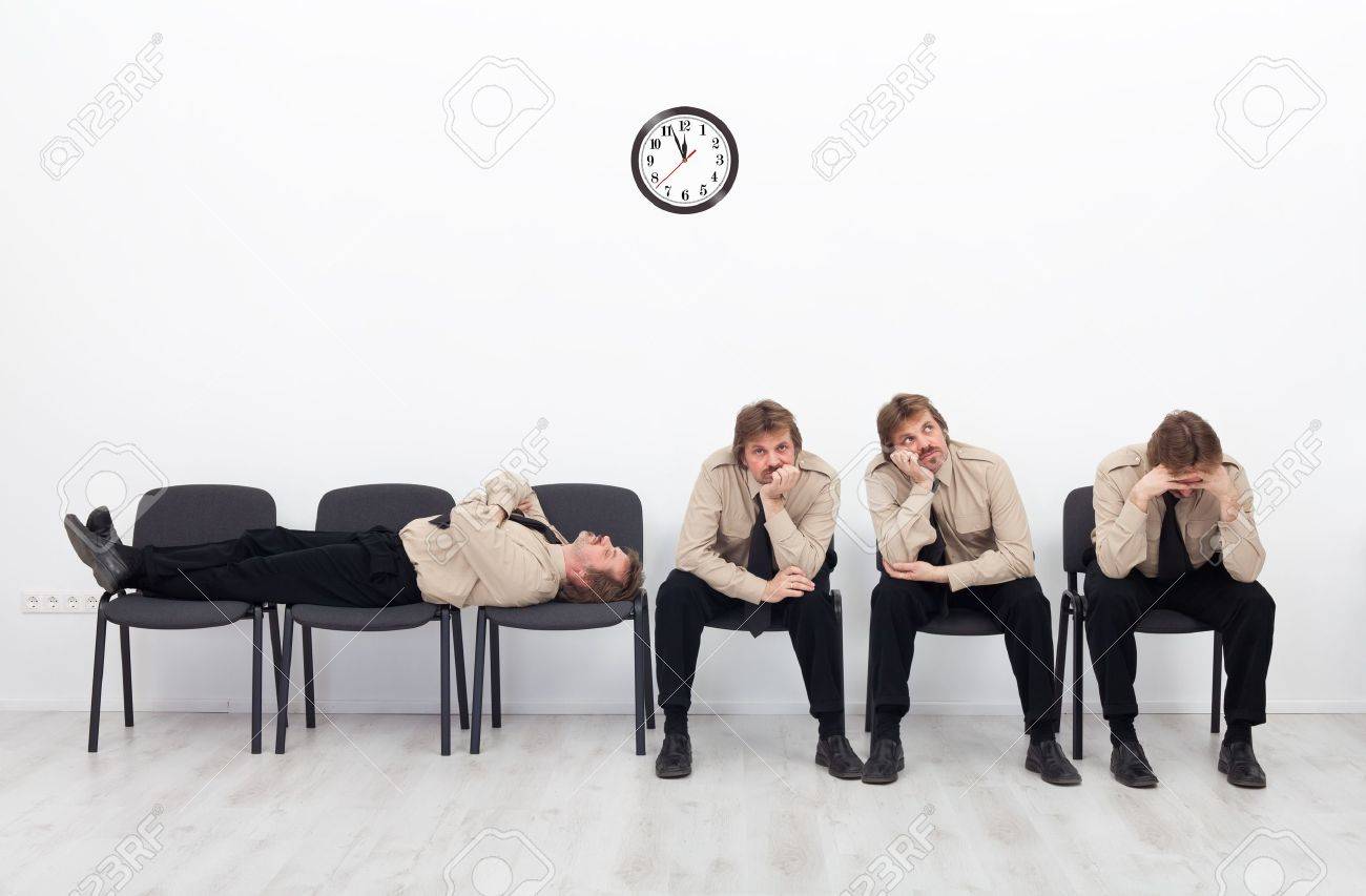 16585078-Bored-stressed-and-exhausted-people-sitting-on-chairs-waiting-Stock-Photo.jpg