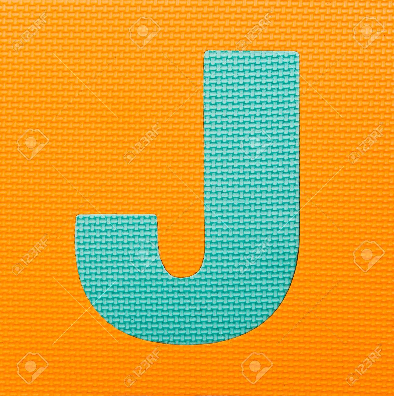 Letter J On Orange Background Stock Photo Picture And Royalty Free Image Image