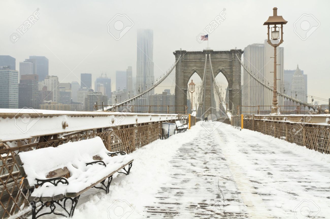 Horizontal photo of a bench on the Brooklyn Bridge during a snowstorm - 11545770 Horizontal photo of a bench on the Brooklyn Bridge during a snowstorm - 11545770