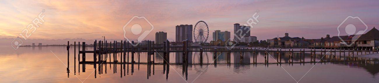 Panoramic photo of sunrise on the on Santa Rosa Sound and Pensacola Beach ferris wheel in Pensacola Beach, Florida - 19524511 Panoramic photo of sunrise on the on Santa Rosa Sound and Pensacola Beach ferris wheel in Pensacola Beach, Florida - 19524511