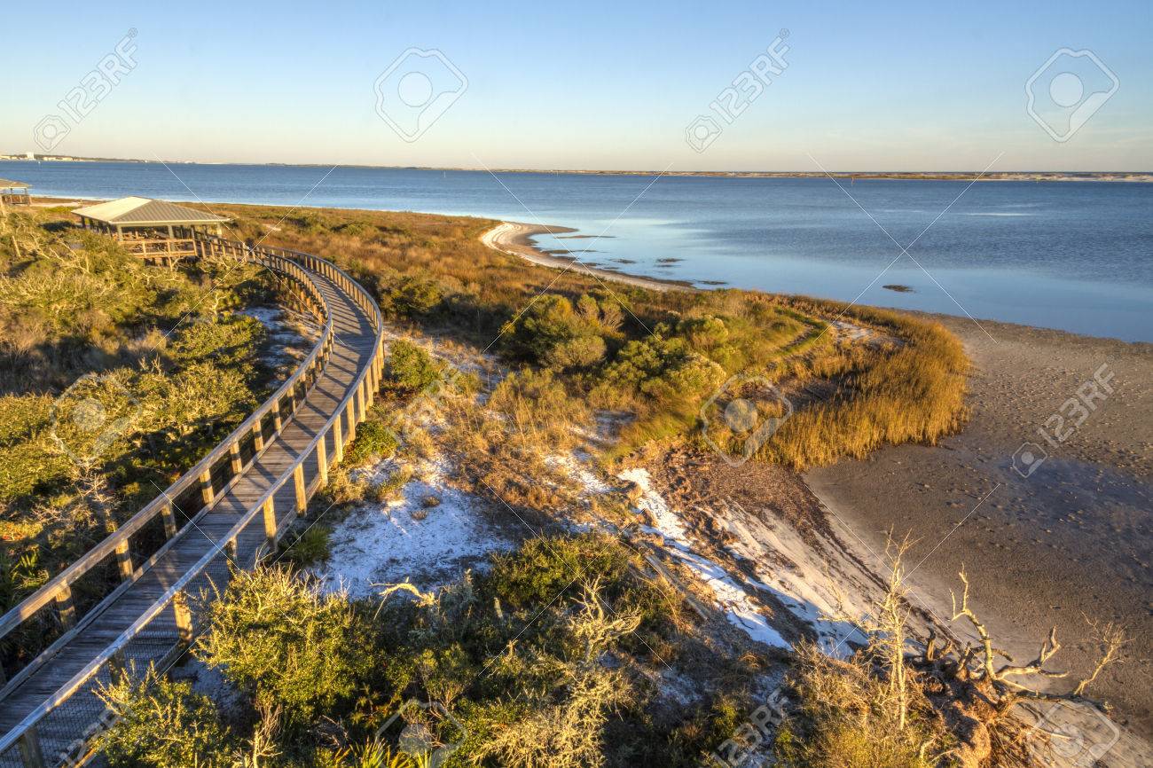 A boardwalkcurves over the vegetation on the dunes in Big Lagoon State Park near Pensacola, Florida - 26752166 A boardwalkcurves over the vegetation on the dunes in Big Lagoon State Park near Pensacola, Florida - 26752166