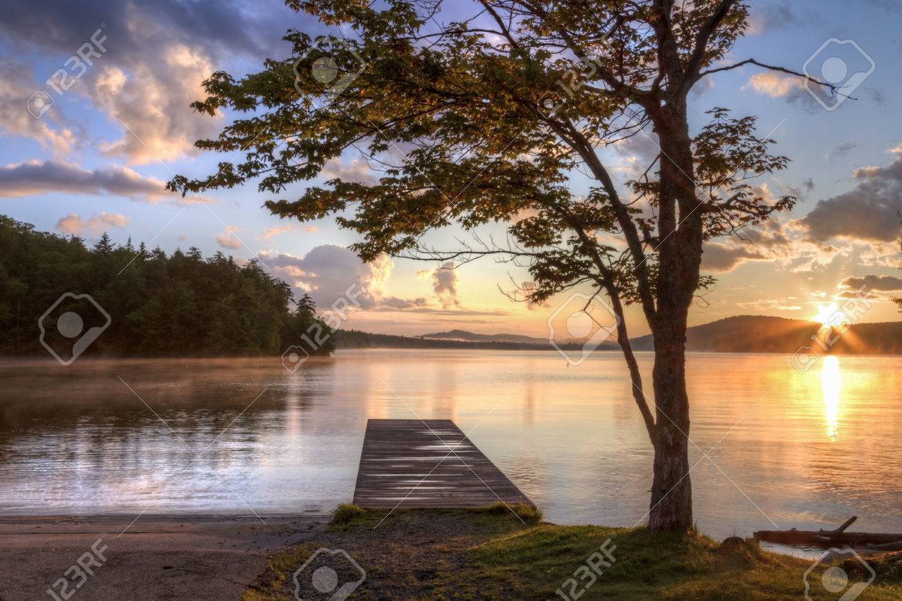 Sunset on the shore of Seventh Lake in the Fulton Chain Lakes region of the Adirondack Mountains of New York - 33631907 Sunset on the shore of Seventh Lake in the Fulton Chain Lakes region of the Adirondack Mountains of New York - 33631907