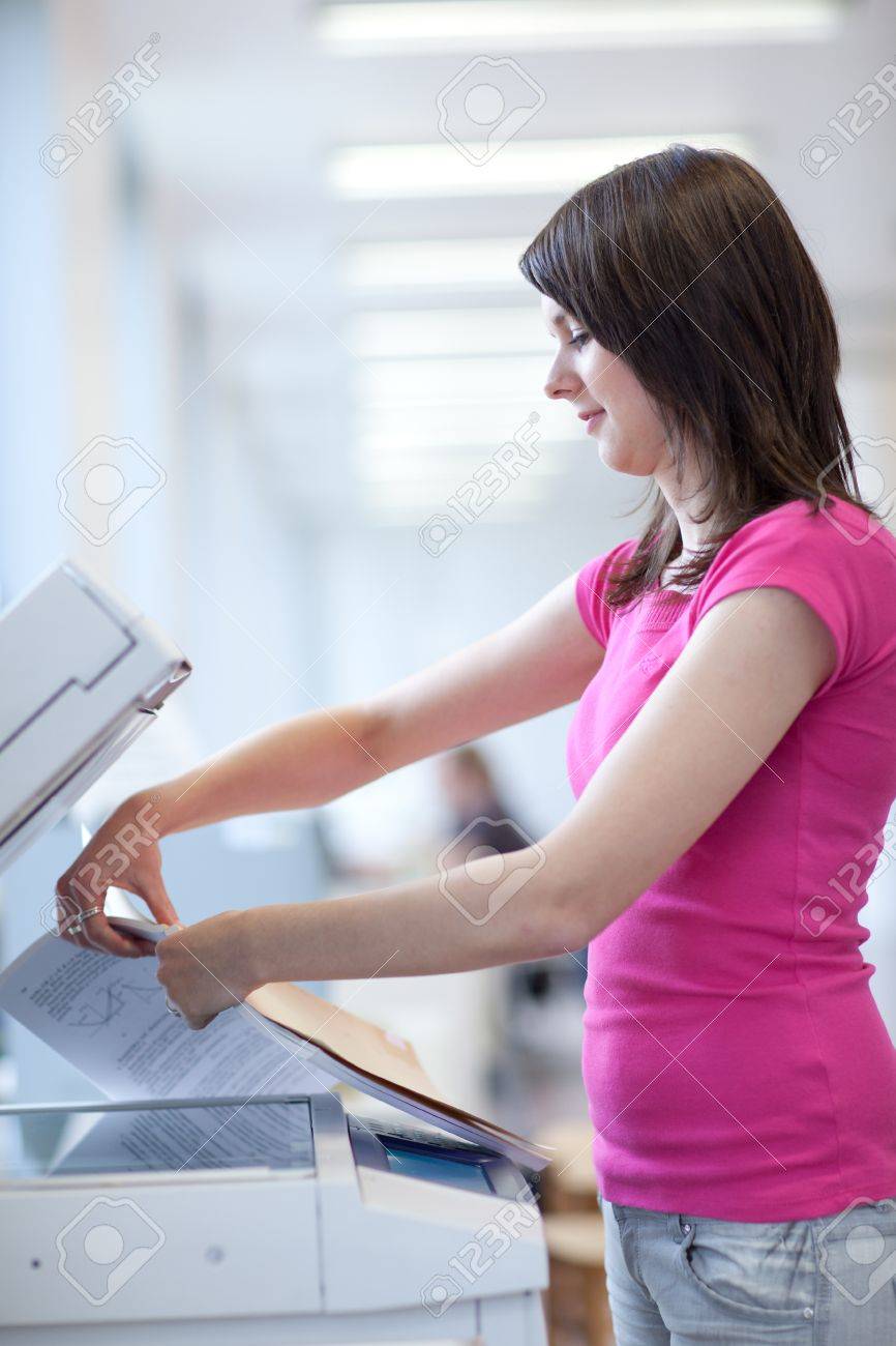 stock photo pretty young woman using a copy machine shallow dof color toned image - Color Copy Machine stock photo pretty young woman using a copy machine shallow dof color toned image - Color Copy Machine