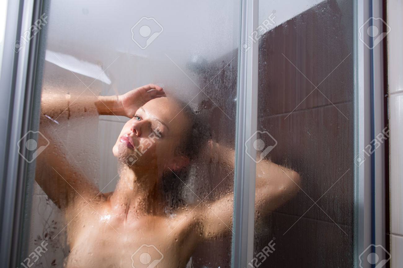 VIKTOR CAPYoung Woman Washing Her Hair With