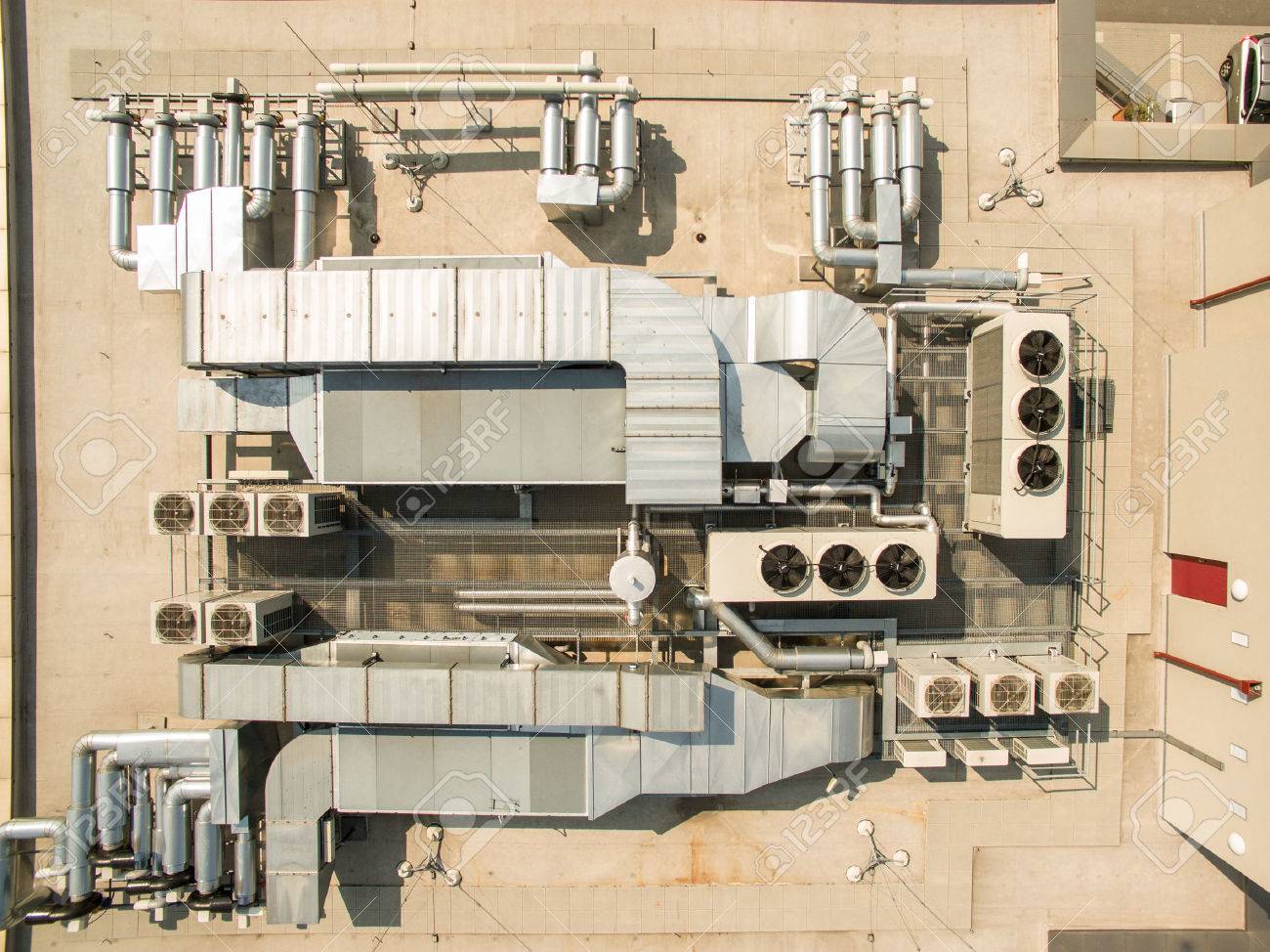 Air conditioning equipment atop a modern building - aerial/drone view of the roof with all the necessary installations - 54567718 Air conditioning equipment atop a modern building - aerial/drone view of the roof with all the necessary installations - 54567718
