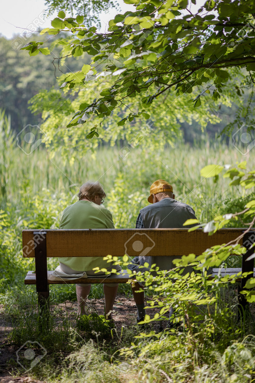 Elderly couple outdoors in summer. Happy elderly couple on a walk. Handsome man and woman senior citizens. Husband and wife of old age against the background of nature. - 171623523 Elderly couple outdoors in summer. Happy elderly couple on a walk. Handsome man and woman senior citizens. Husband and wife of old age against the background of nature. - 171623523