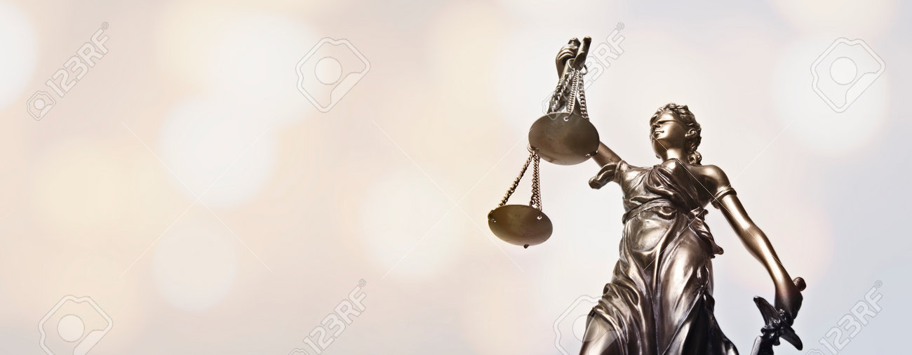 Lady justice - blindfolded figurine. Low angle view. Panoamic image wih copy space. - 162629749 Lady justice - blindfolded figurine. Low angle view. Panoamic image wih copy space. - 162629749
