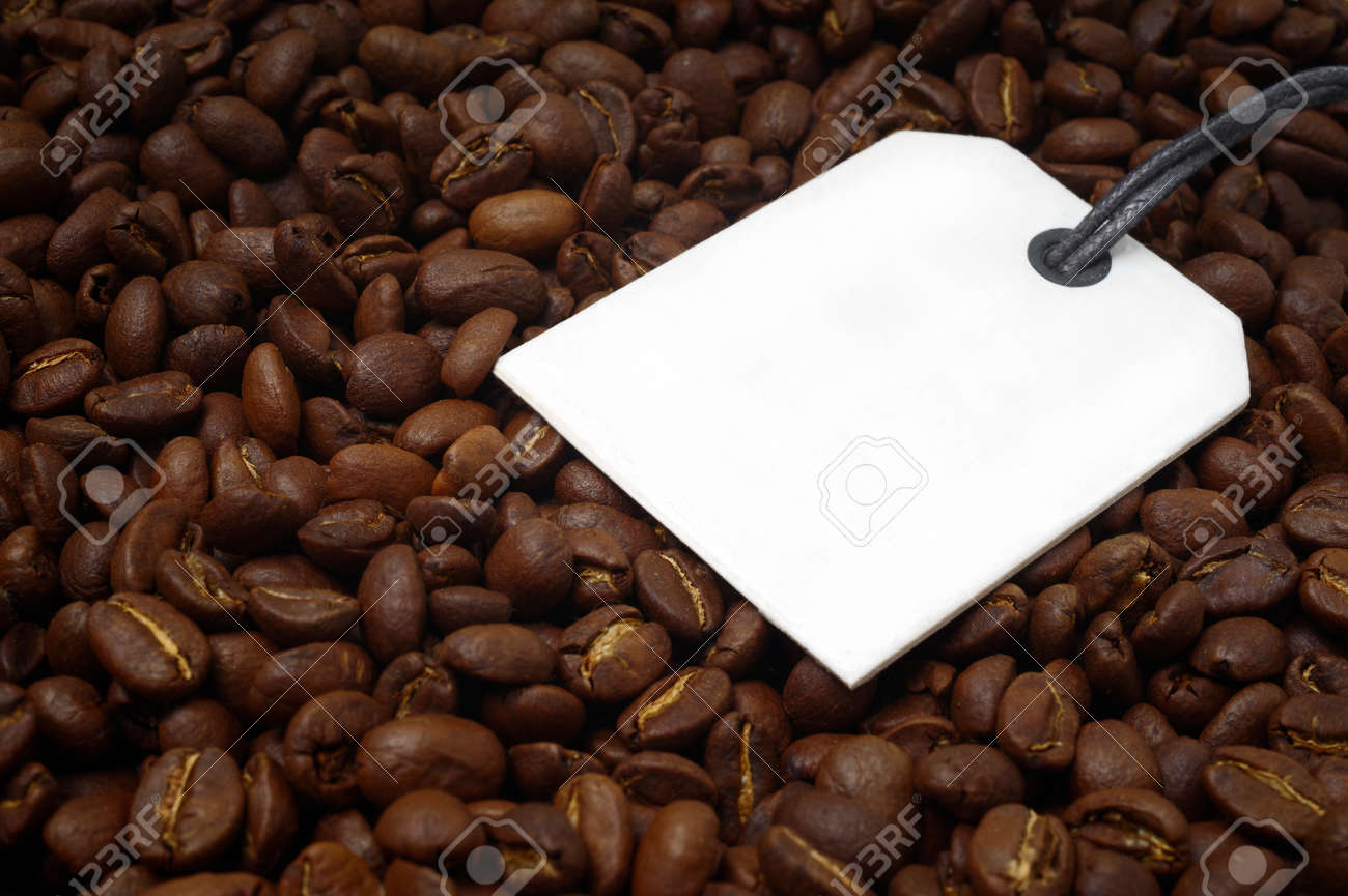 Close-up of a bunch of roasted coffee beans. Horizontal image with label for your individual text. - 164394424 Close-up of a bunch of roasted coffee beans. Horizontal image with label for your individual text. - 164394424