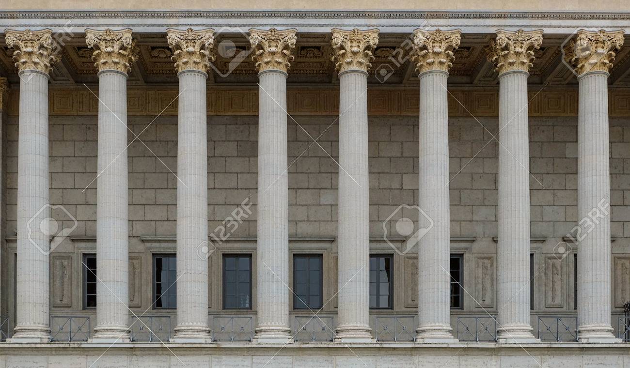 a row of corinthian columns in a neoclassical colonnade of a corinthian columns