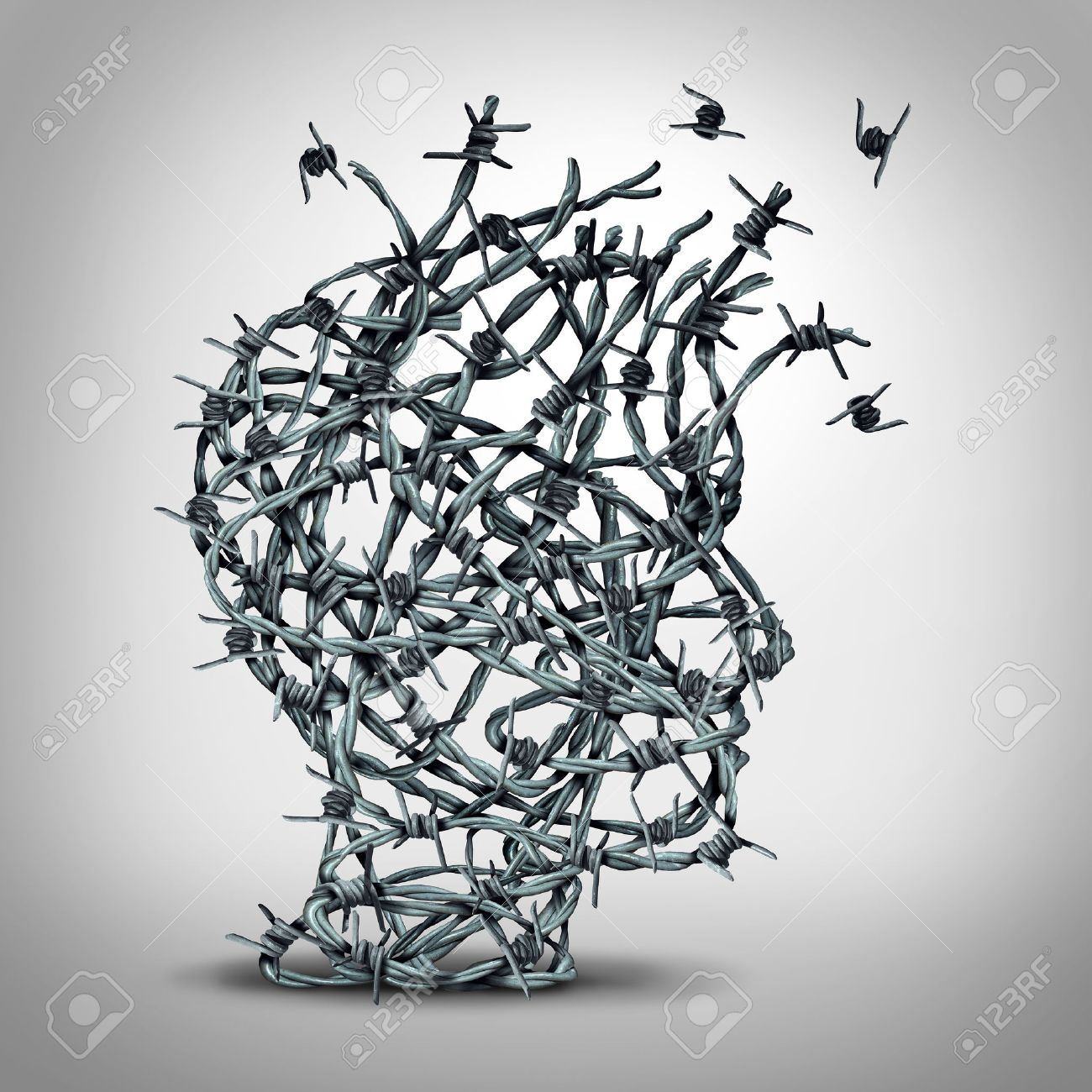 Anxiety solution and freedom from fear and escape from tortured thinking and depression concept as a group of tangled barbwire or barbed wire fence shaped as a human head breaking free as a metaphor for psychological or psychiatric icon. - 50923995 Anxiety solution and freedom from fear and escape from tortured thinking and depression concept as a group of tangled barbwire or barbed wire fence shaped as a human head breaking free as a metaphor for psychological or psychiatric icon. - 50923995
