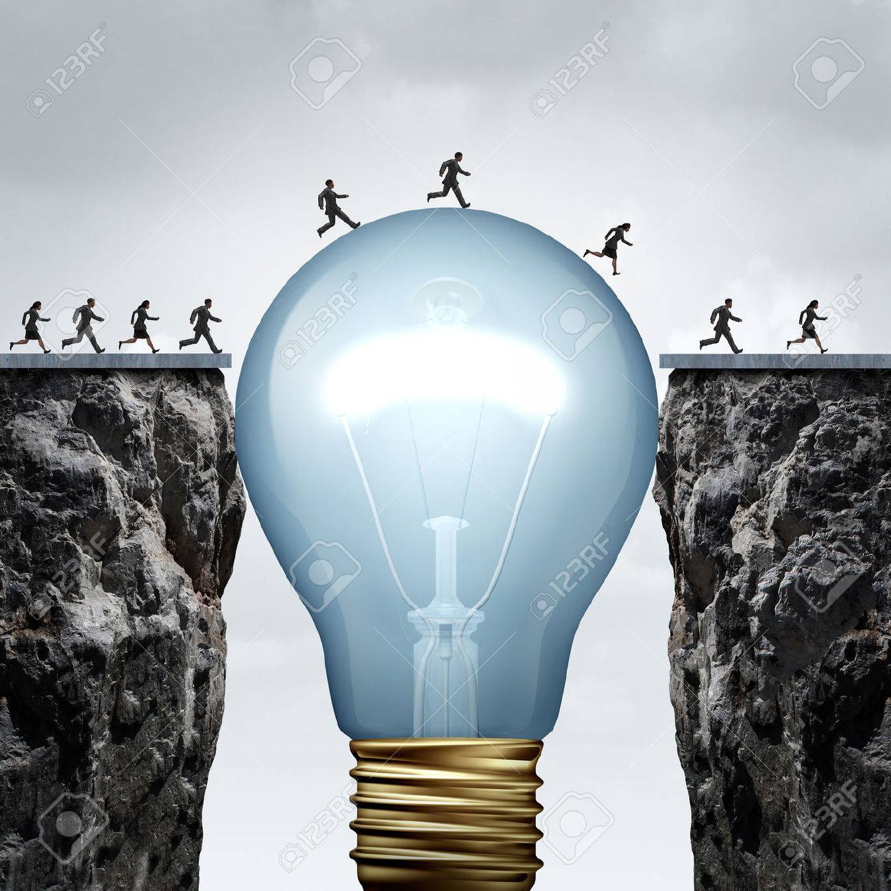 Creativity business idea solution as a group of people on two divided cliffs being connected by a giant light bulb closing the gap and creating a bridge to enable a crossing to success as a cretive thinking metaphor.. - 51757391 Creativity business idea solution as a group of people on two divided cliffs being connected by a giant light bulb closing the gap and creating a bridge to enable a crossing to success as a cretive thinking metaphor.. - 51757391