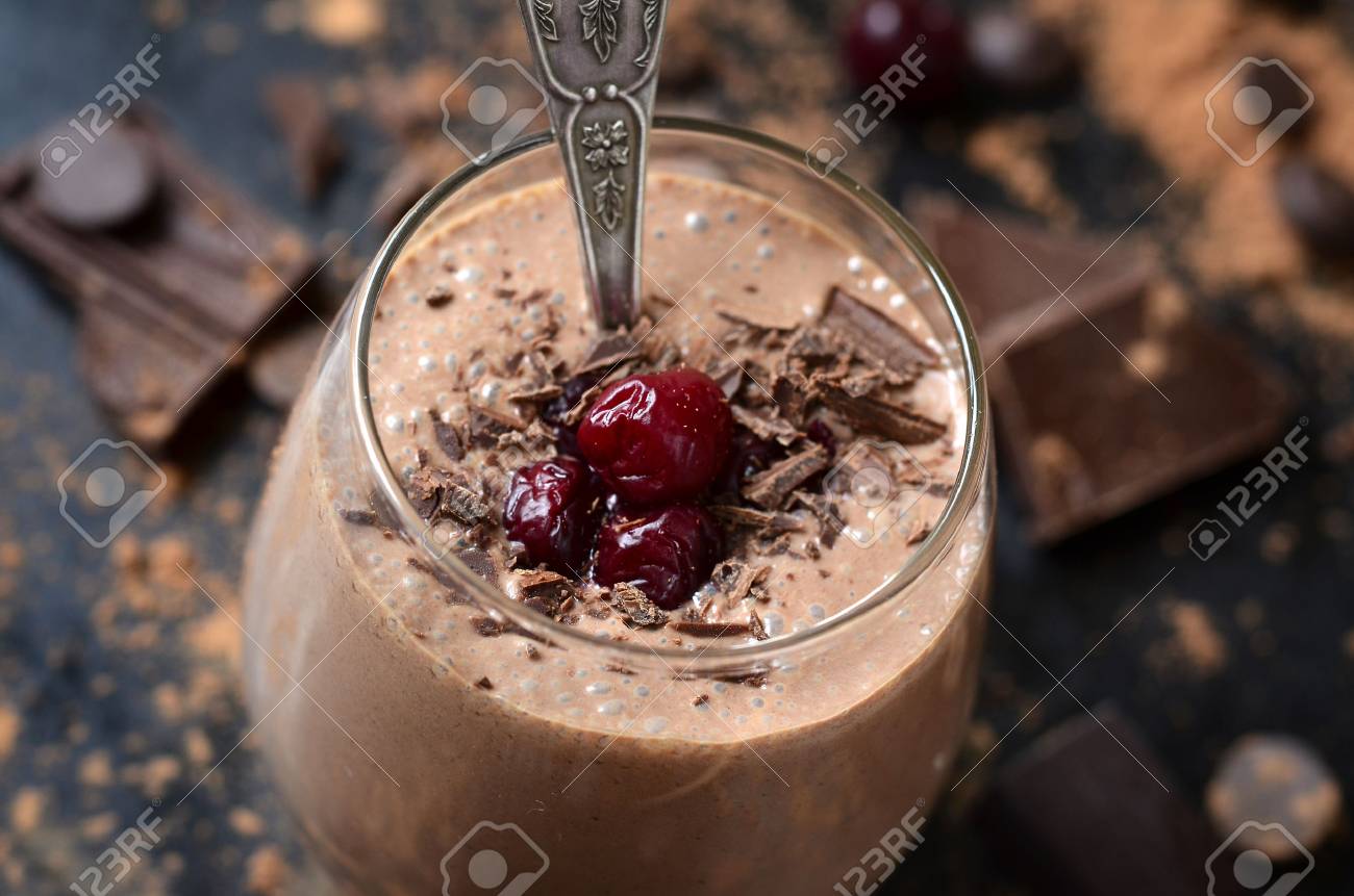 Delicious chocolate smoothie "Black forest" with cherry on dark table. - 50089181 Delicious chocolate smoothie "Black forest" with cherry on dark table. - 50089181