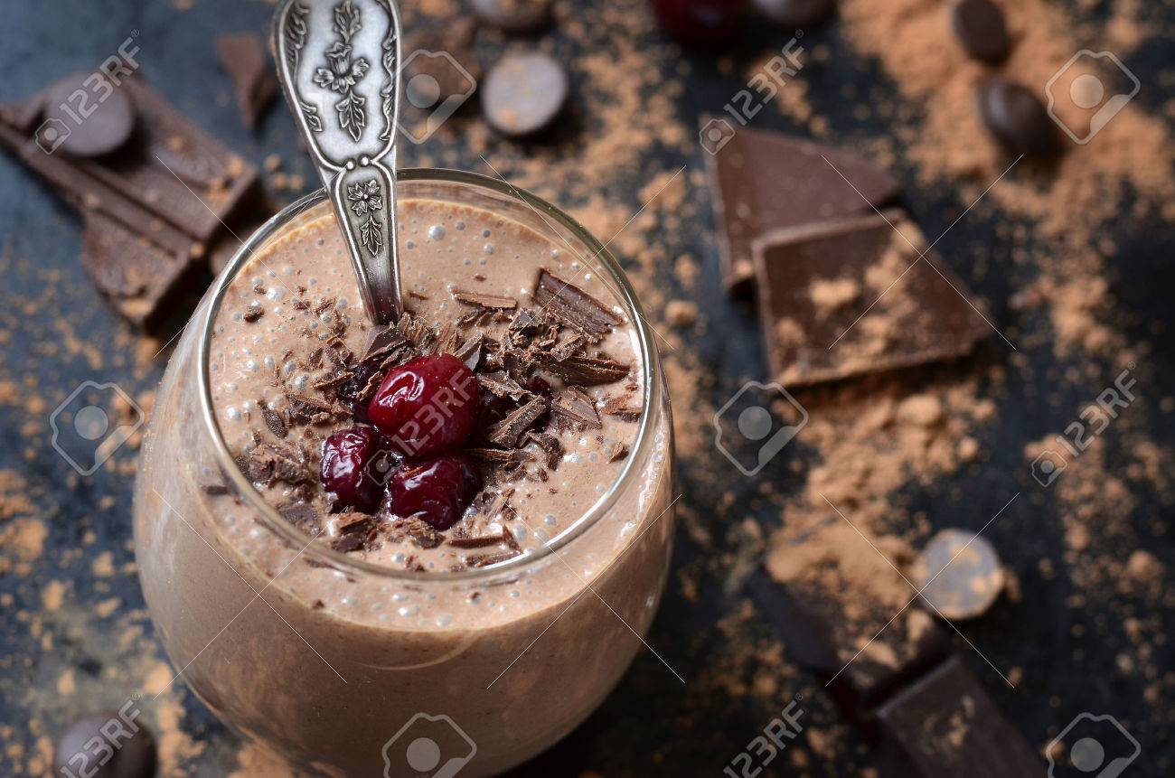 Delicious chocolate smoothie "Black forest" with cherry on dark table. - 50089184 Delicious chocolate smoothie "Black forest" with cherry on dark table. - 50089184