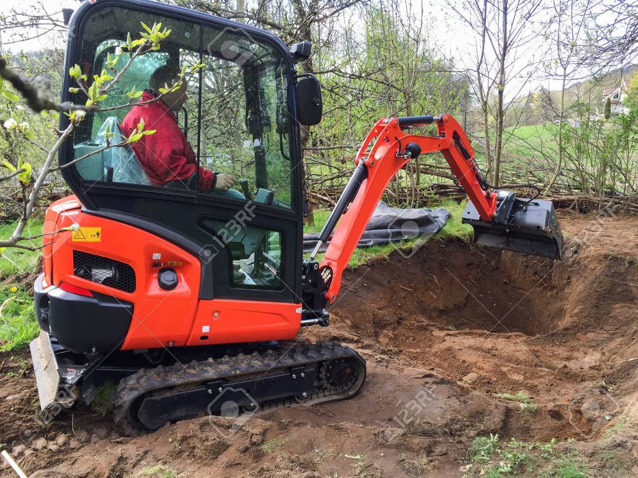 making a pond fish small excavator with man inside at work making garden pond stock photo 75808716 excavator with man inside at work making garden pond making a pond fish small excavator with man inside at work making garden pond stock photo 75808716 excavator with man inside at work making garden pond