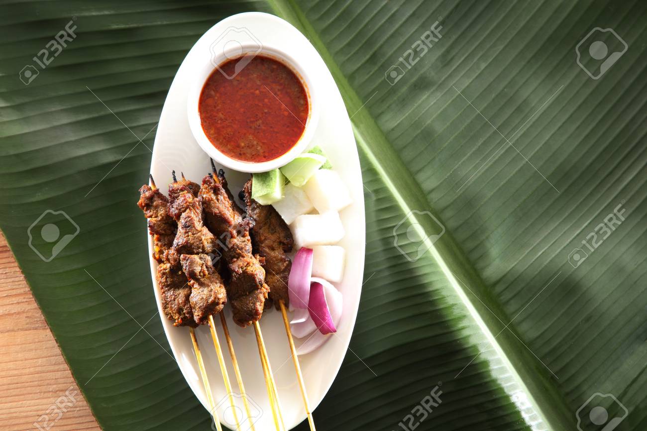 Malaysian Famous Food Satay On The Plate With The Cucumber And