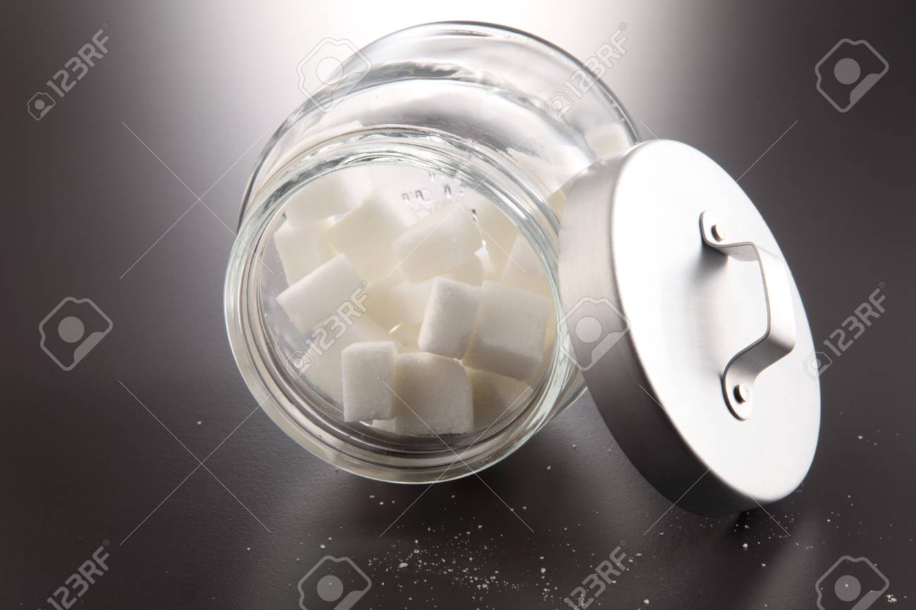 White Lump Sugar In A Glass Jar On A Gray Background Sweet Sugar