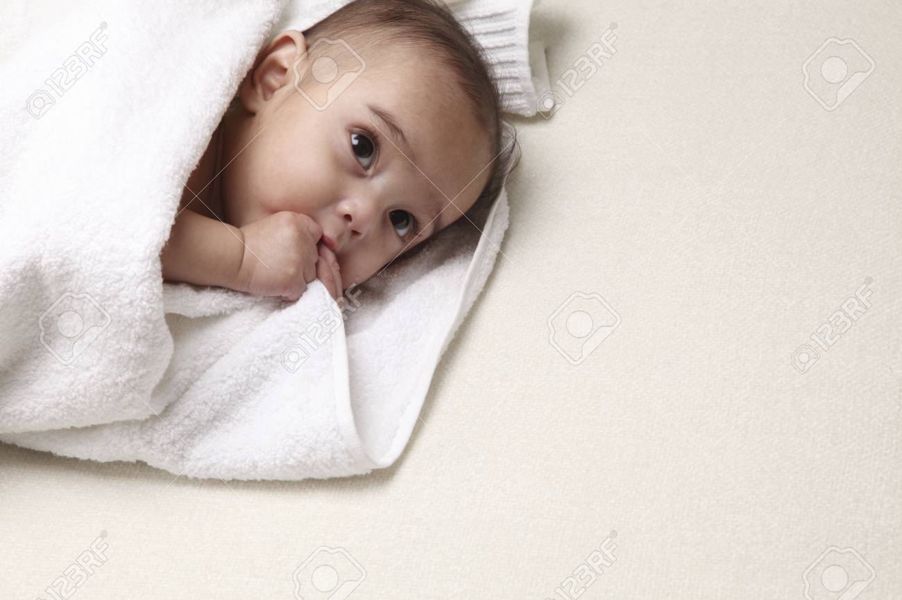 baby holding towel