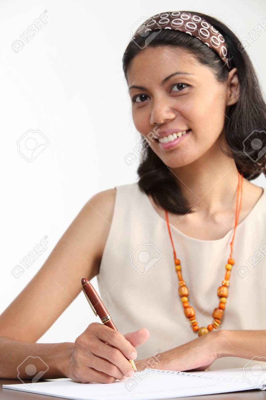 Malay Woman Hold A Pen Sitting At Office Desk Stock Photo Picture And Royalty Free Image Image 125267830