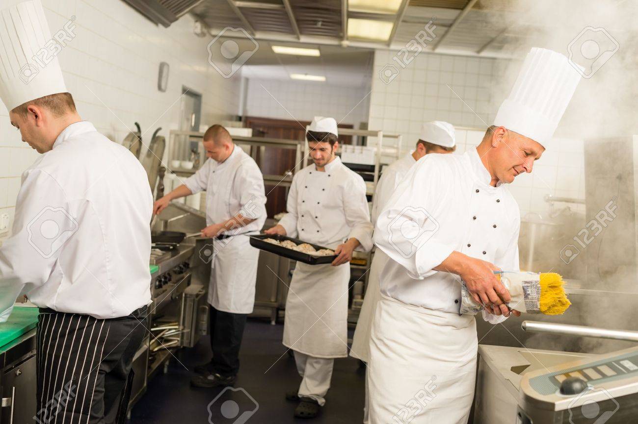 Professional kitchen busy team cooks and chef prepare meal - 30203767 Professional kitchen busy team cooks and chef prepare meal - 30203767