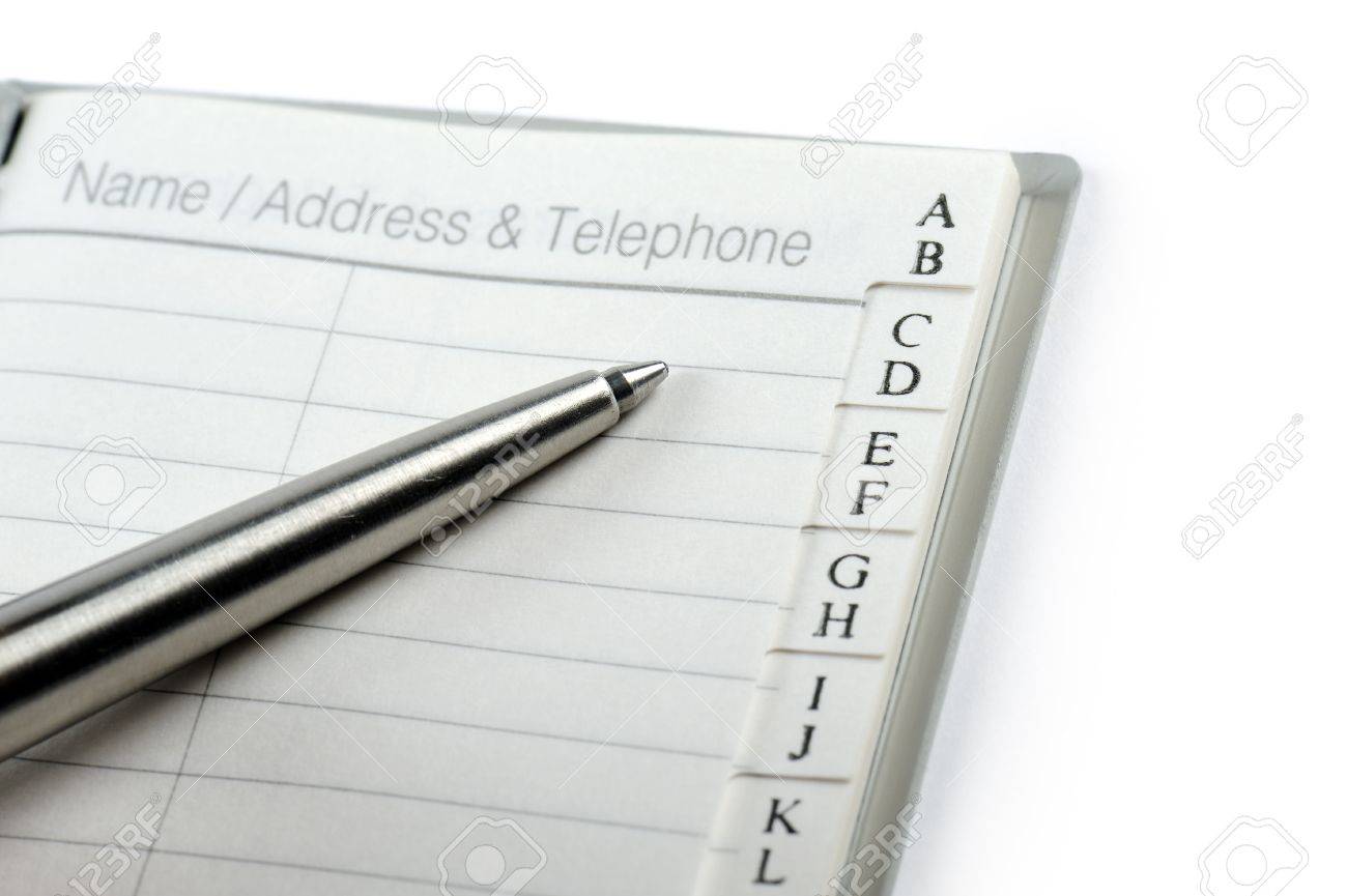 personal address book with ballpen on white background stock photo personal telephone book