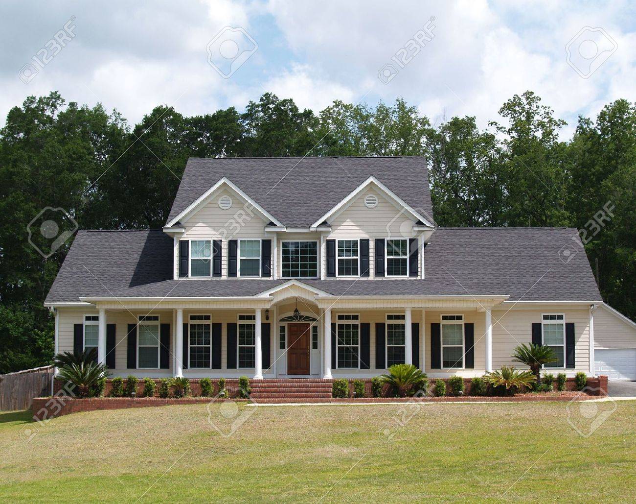 Two story residential home with with board siding on the facade. - 5520066 Two story residential home with with board siding on the facade. - 5520066