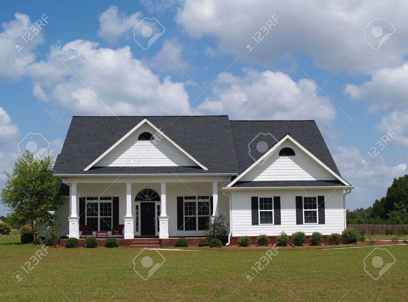 One story residential home with board siding on the facade. - 5520079 One story residential home with board siding on the facade. - 5520079