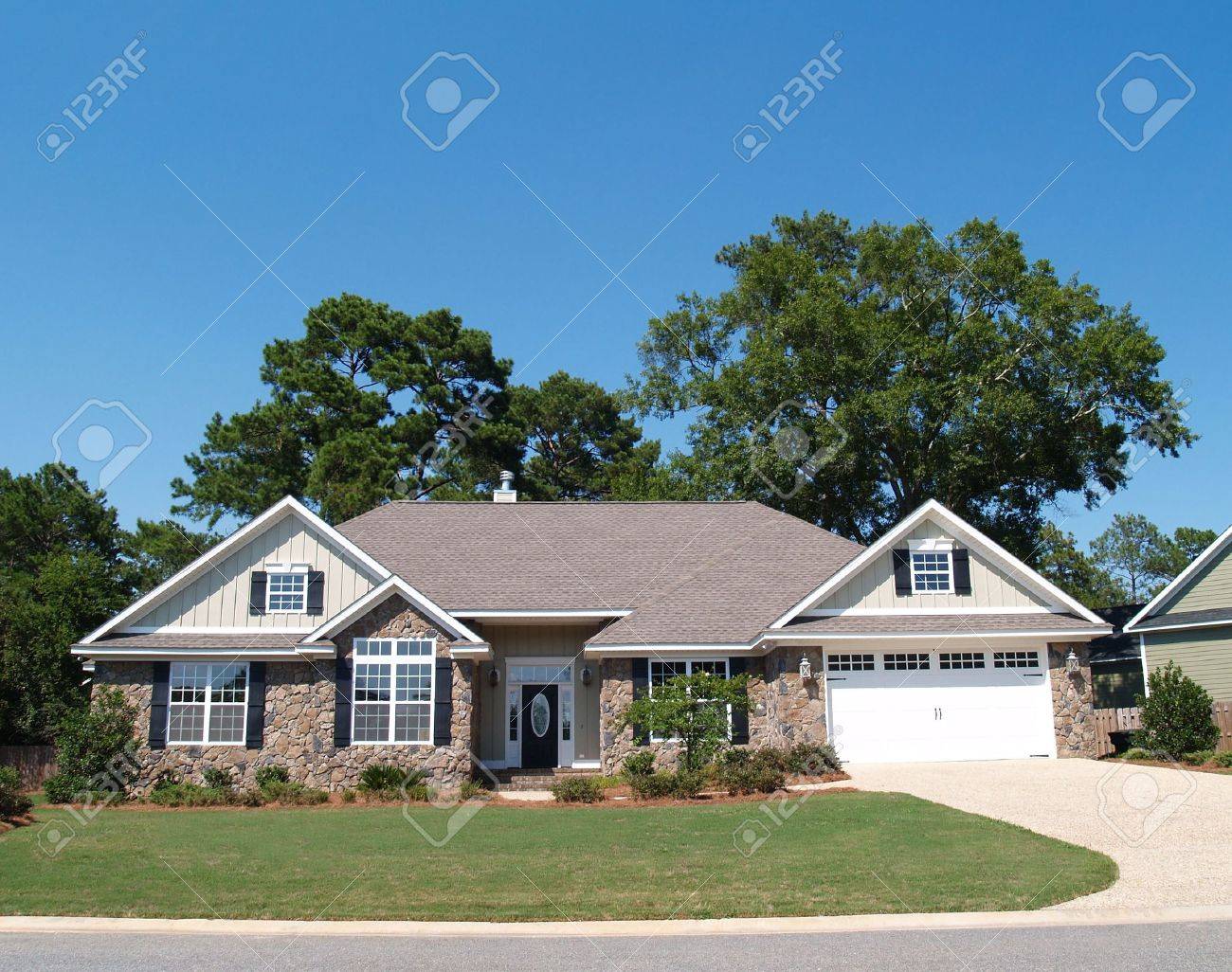One story residential home with a stone facade. - 5520025 One story residential home with a stone facade. - 5520025